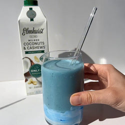 Carton of Elmhurst oat milk used to make a chocolate oat milkshake with granola