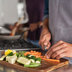 a man cutting vegetables