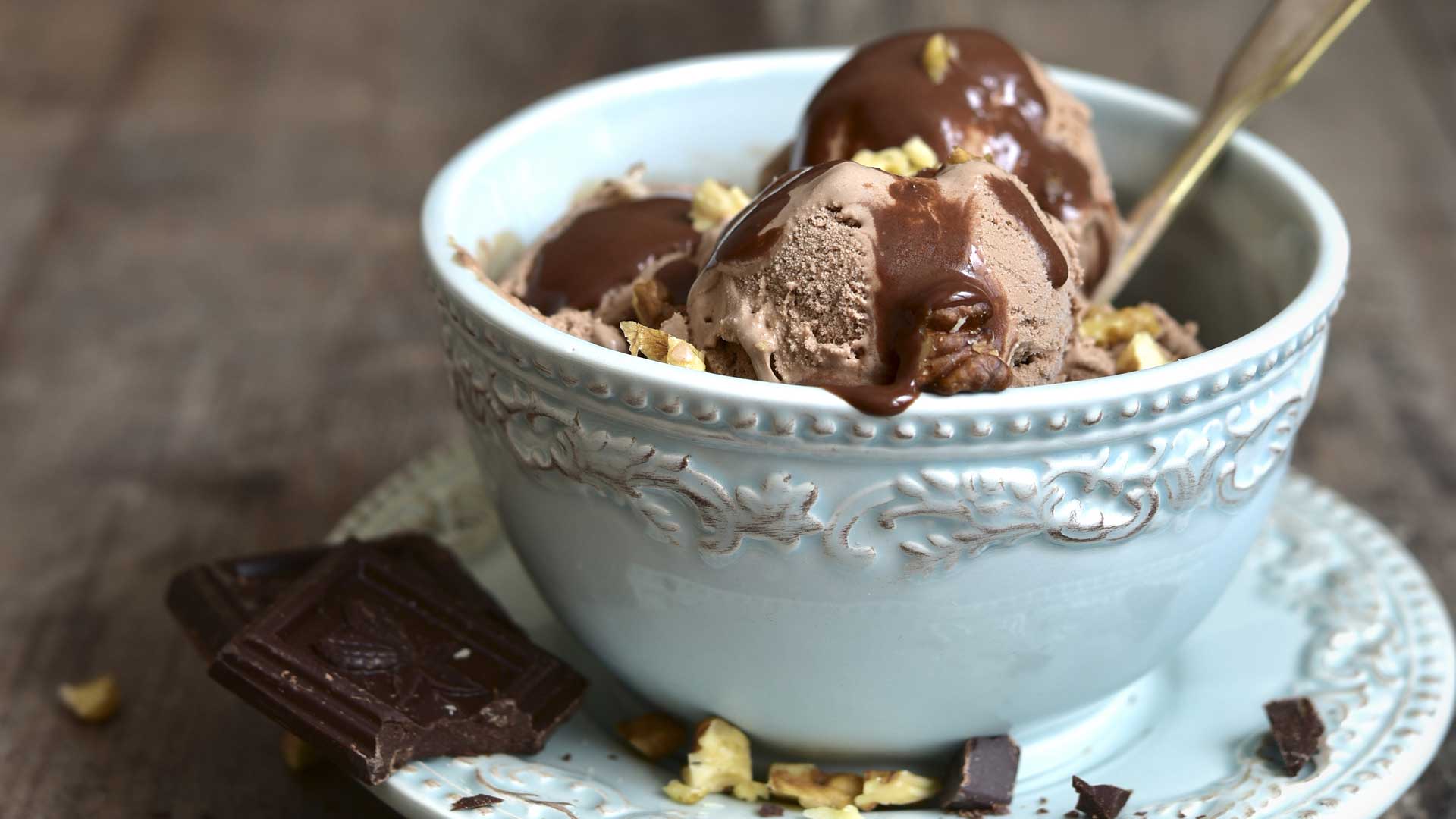 a bowl of homemade chunky monkey nice cream made with Elmhurst Walnut Milk