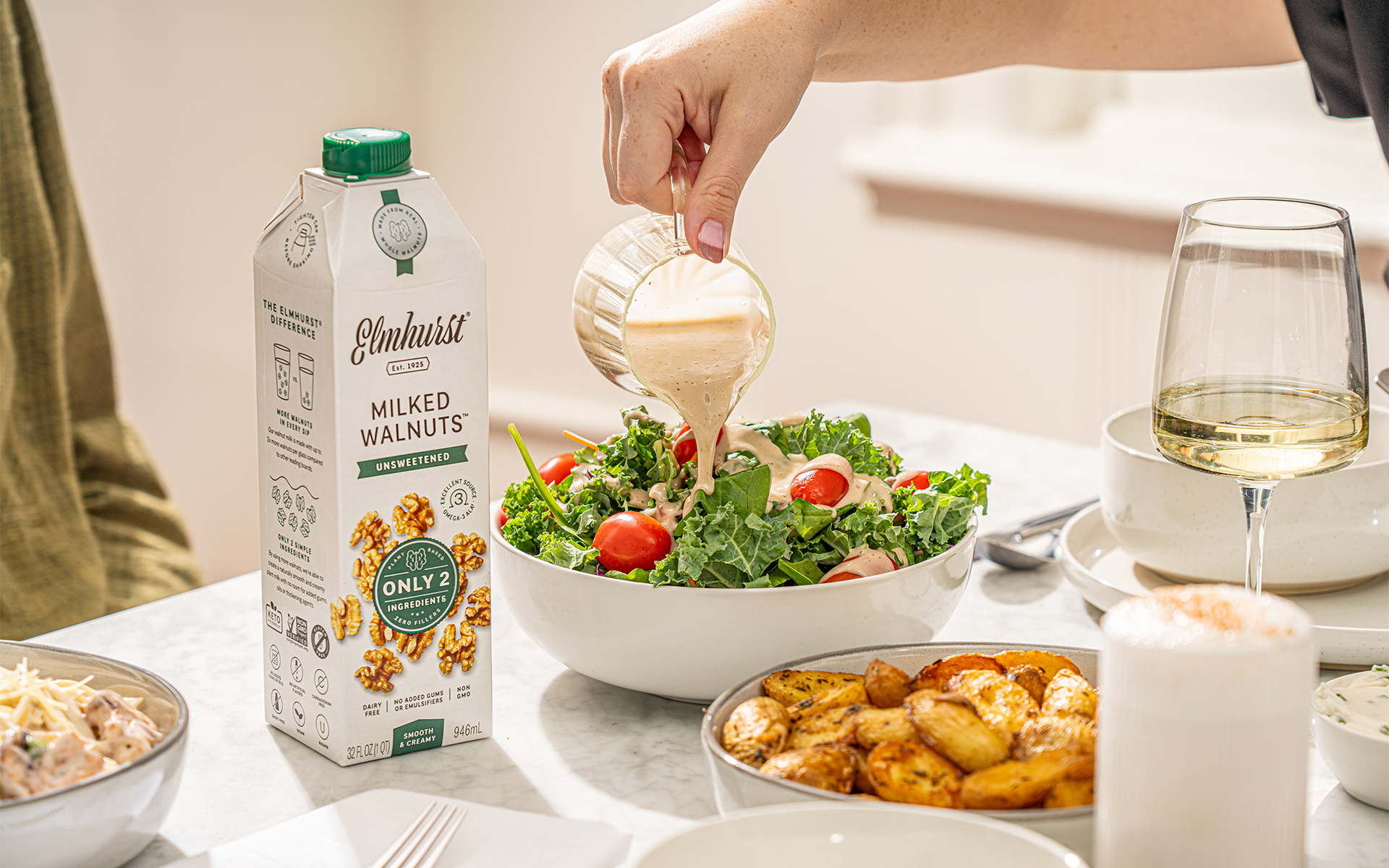 a bowl of salad with walnuts and vegan walnut vinaigrette dressing