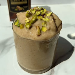 a bowl of homemade chunky monkey nice cream made with Elmhurst Walnut Milk