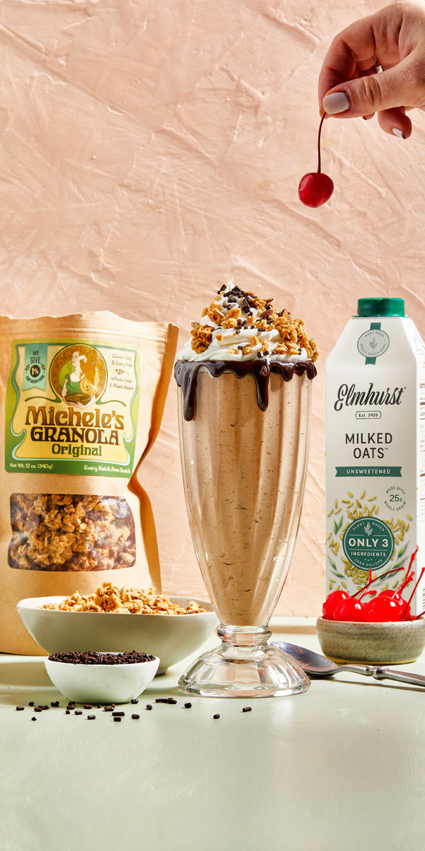 Carton of Elmhurst oat milk used to make a chocolate oat milkshake with granola