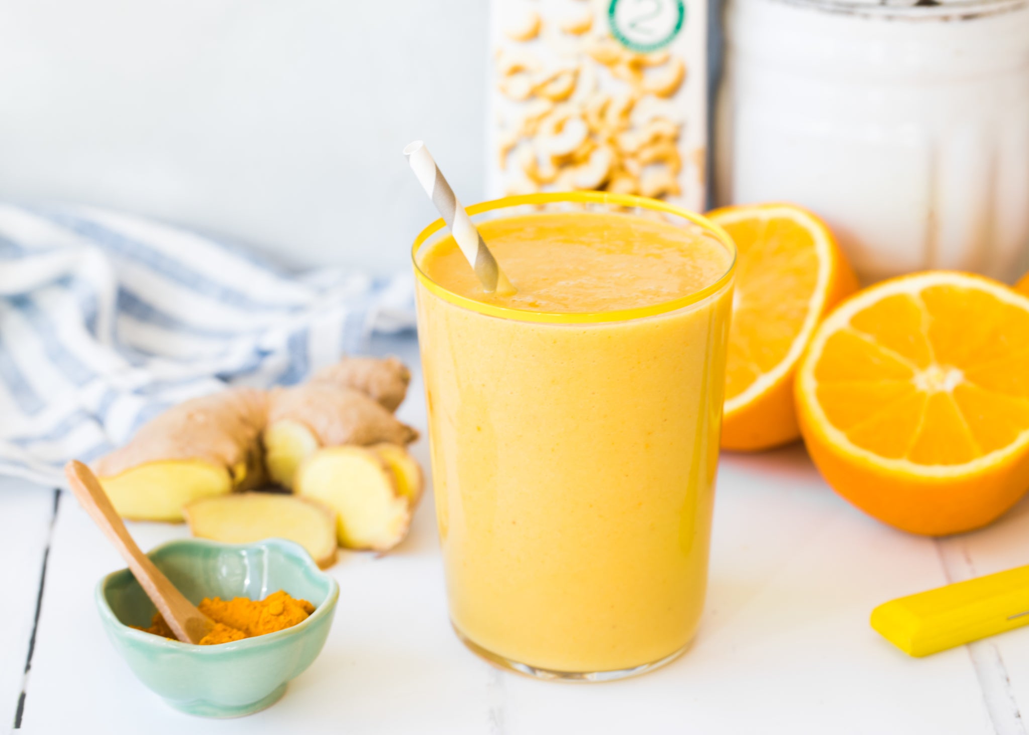 orange ginger turmeric smoothie with mango and cashew milk