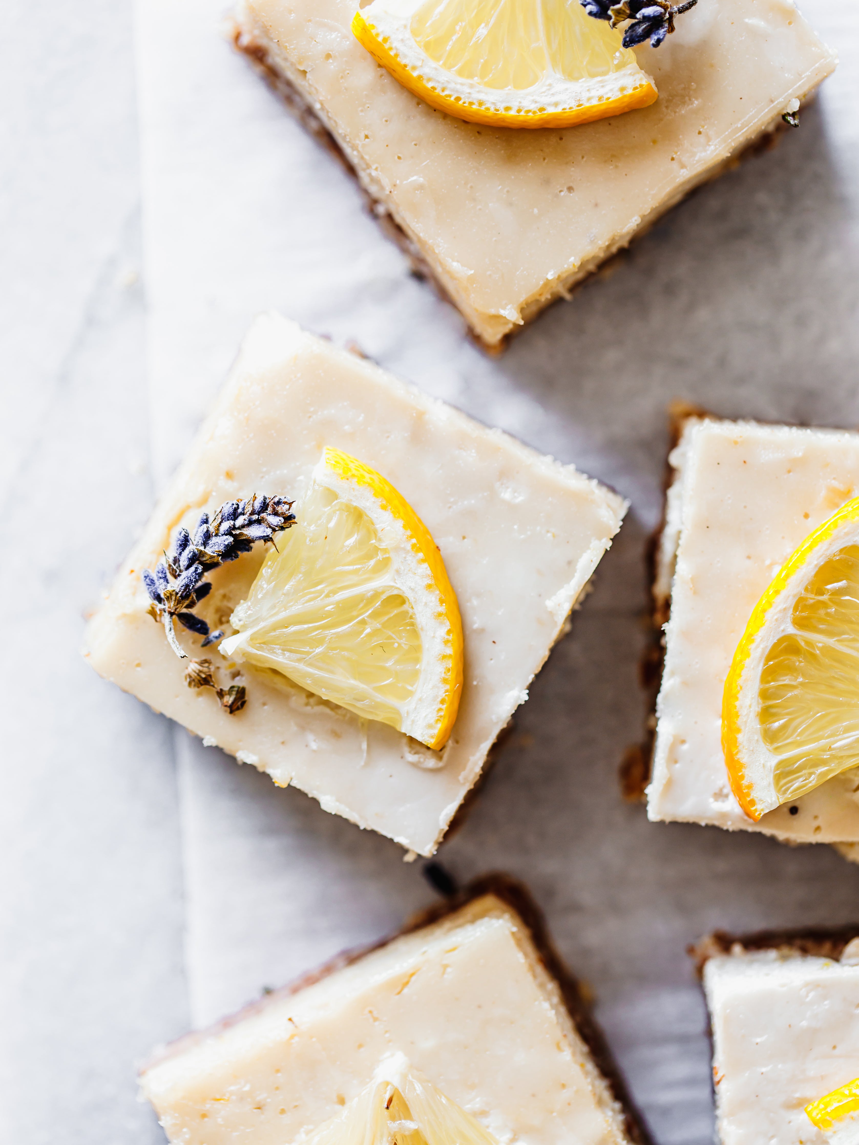 no-bake lavender lemon bars with lavender and sliced lemons