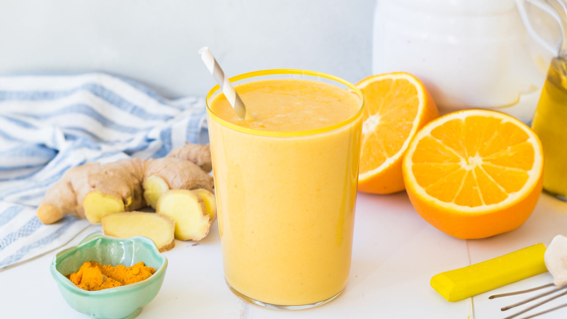 orange ginger turmeric smoothie with mango and cashew milk