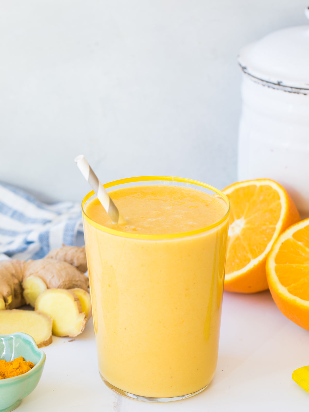 orange ginger turmeric smoothie with mango and cashew milk