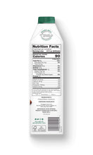 Load image into Gallery viewer, The side of a carton of Elmhurst Unsweetened Hazelnut Milk with nutrition, serving size, and ingredients info